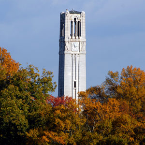 Memorial Belltower rises up from behind the changing leaves of Fall. PHOTO BY ROGER WINSTEAD